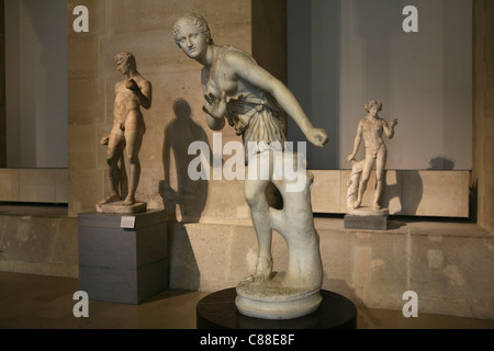 Roman marble statues on display in the Louvre Museum in Paris, France. Stock Photo