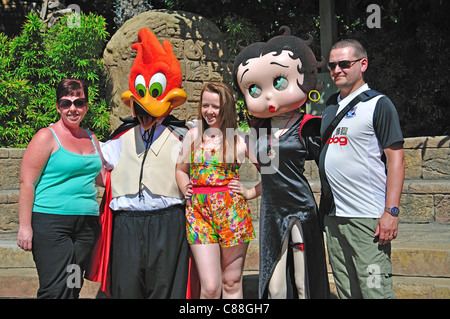 Family posing with 'Woody' and 'Betty', PortAventura Theme Park, Salou, Costa Daurada, Province of Tarragona, Catalonia, Spain Stock Photo