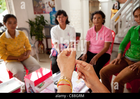 Women attend an IUD demonstration at a reproductive health clinic in Kampong Cham, Cambodia, SE Asia. Stock Photo