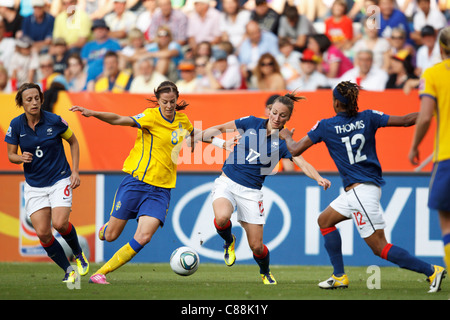 Lotta Schelin of Sweden (8) and Gaetane Thiney of France (17) challenge for the ball during a 2011 FIFA Women's World Cup match. Stock Photo