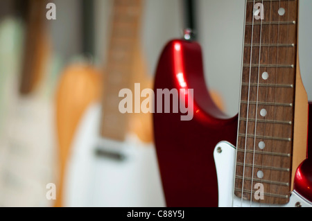 Ordered acoustic guitars in shop. Close up Stock Photo