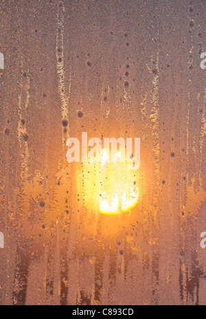 Frost on winter window at dawn, 40 below zero, Northwest Territories, Canada Stock Photo