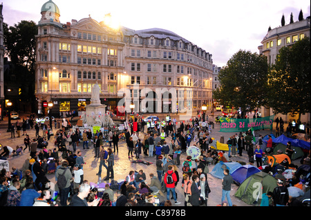The autumn sun sets on the second days’Occupy Stock Exchange’ protest,St Pauls Cathedral, - Occupy London Stock Exchange OLX is part of a global movement against corporate greed in the face of bank bailouts, unemployment, inequality and austerity measures. City of London, UK. 16th Oct 2011 Stock Photo
