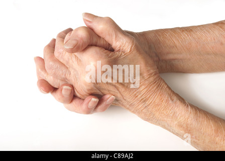 Old Lady's hands clasped - My mother at 90 years old with arthritic hands Stock Photo
