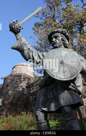 City of Stirling, Scotland. The Rob Roy McGregor statue with the city wall Watchtower in the background. Stock Photo