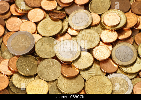 A pile of used, circulated, modern, Euro coins. All of the current Euro coin denominations are represented in this image. Stock Photo