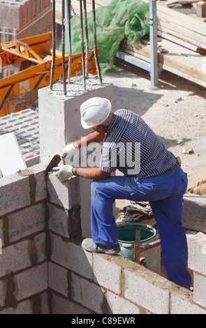 Construction worker building new house on Gran Canaria, Canary Islands, Spain Stock Photo
