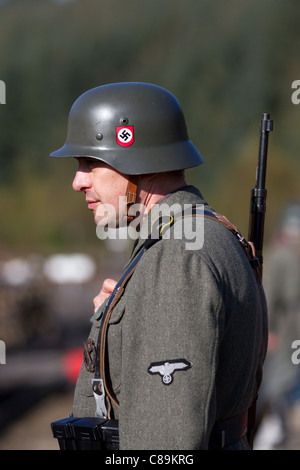 The Germans (Railway station guards) at 'Le Visham' or Levisham on the 16th of October, 2011. Costumed German army Soldiers, World War Two, World War II, Second World War, WWII, WW2 Re-enactors at the Pickering War and Wartime Weekend, North Yorkshire, UK Stock Photo