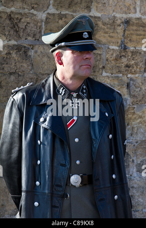 German soldier SS Officer, with Iron cross wearing leather great  coat & cap. The Germans re-enactors were based at 'Le Visham' or Levisham on the 15th 16th October, 2011. Costumed Soldiers and World War Two, World War II, Second World War,  WWII, WW2 Re-enactors at the assemble for the Pickering World War II,  Wartime Weekend, North Yorkshire, UK Stock Photo