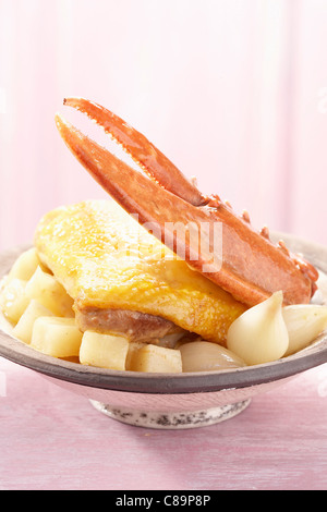 Chicken leg with lobster and root celery Stock Photo