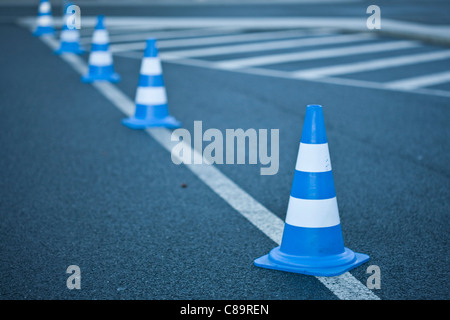 Germany, Wolfsburg, Traffic cones on road marking Stock Photo