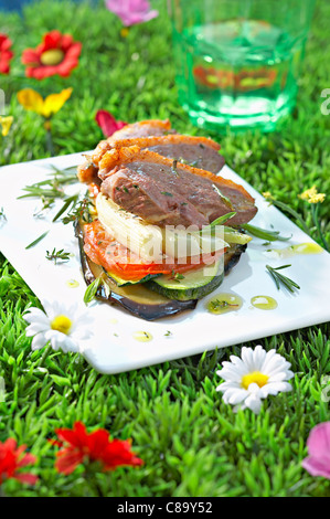 Duck magret and summer vegetable mille-feuille Stock Photo