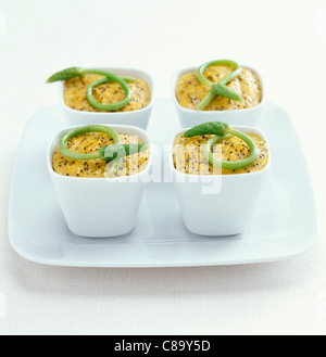 Mini carrot flans with poppyseeds and wild asparagus Stock Photo