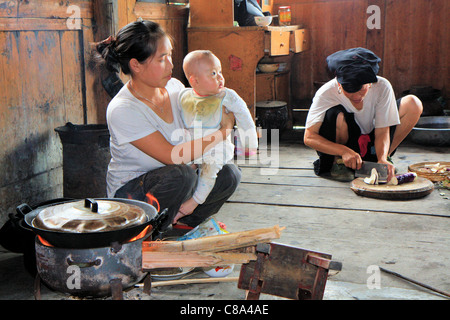 Typical Chinese family cooking inside their house, Ping'an, Guanxi, China Stock Photo