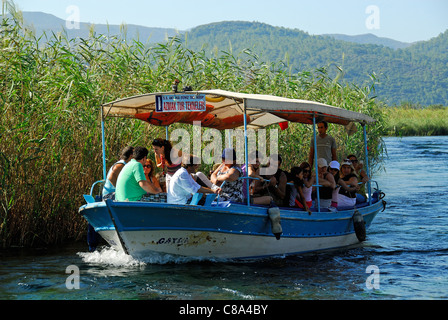 AKYAKA, TURKEY. A pleasure boat taking holidaymakers along the Azmak river in the Gokova conservation area. 2011. Stock Photo