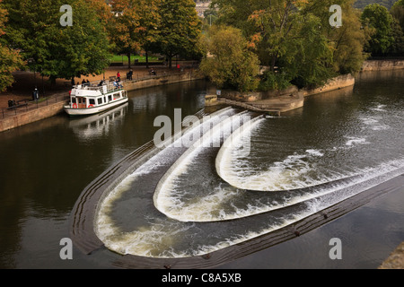 Tourist sightseeing cruise boat moored on the River Avon by Pulteney weir in Bath Somerset England UK Britain Stock Photo