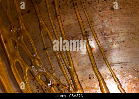 Toffee threads on the side of a copper pan Stock Photo