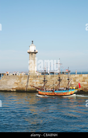 Holidaymakers on boat trip leaving Whitby harbour. North Yorkshire, England, United Kingdom Stock Photo