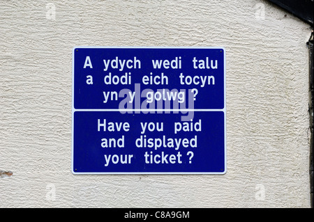 pay and display car park sign in English and welsh betws-y-coed wales uk Stock Photo