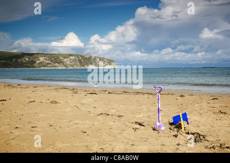 Bucket and spade on Swanage beach Stock Photo