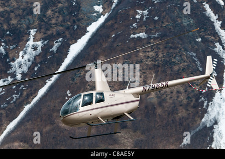 Robinson R44 Raven II helicopter in flight, Valdez Fly-in and Air Show, Valdez, Alaska. Stock Photo