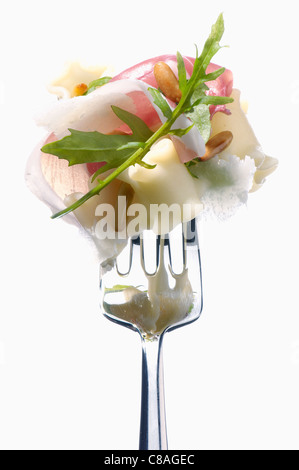 Fork with lasagnelle,parma ham and rocket Stock Photo