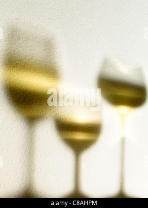 Shadow of glasses of white wine Stock Photo