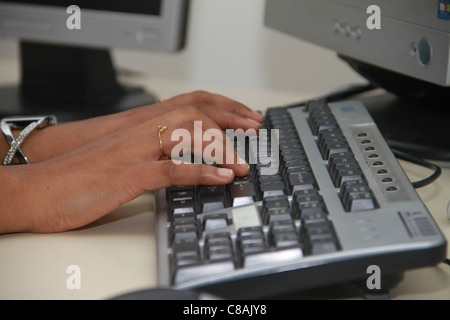typing on keyboard Stock Photo