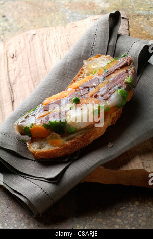 Beef in aspic on a slice of bread Stock Photo