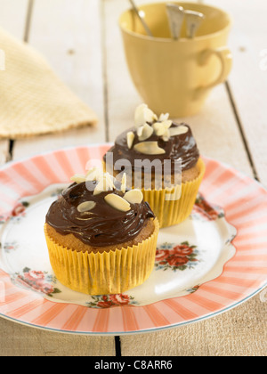 Banana cup cakes with chocolate topping Stock Photo
