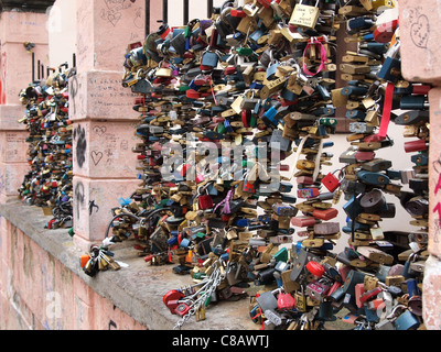 love locks in Prague (a custom by which padlocks are affixed to a bridge by lovers  to symbolize their everlasting love) Stock Photo