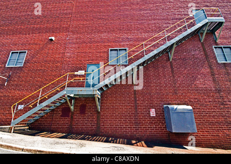 Metal Stairs on brick wall Stock Photo