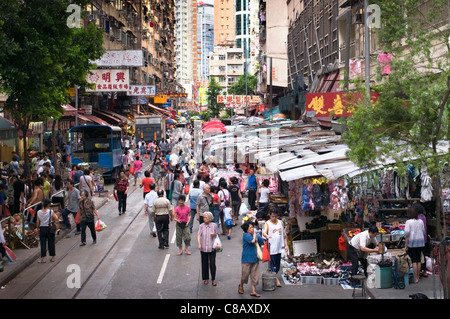 Street market in Hong Kong selling everything from cloths to live animals and food. The more real image of asian market growht Stock Photo