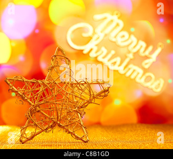 Golden star with Merry Christmas written in lights background Stock Photo