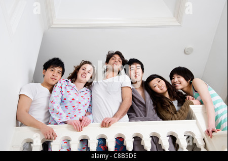 Low angle view of young friends smiling together Stock Photo