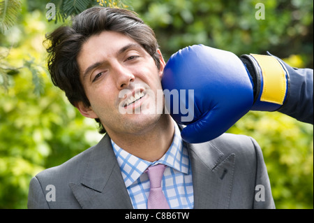 Young man getting hit Stock Photo