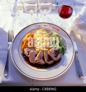 saddle of young rabbit with plums and fresh pasta Stock Photo