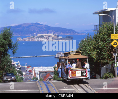 Cable car on Hyde Street with Alcatraz Island in background, San Francisco, California, United States of America Stock Photo