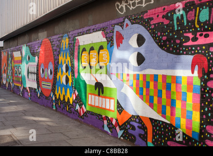 Graffiti on the rear of Rich Mix arts venue in Shoreditch. London. UK. Stock Photo