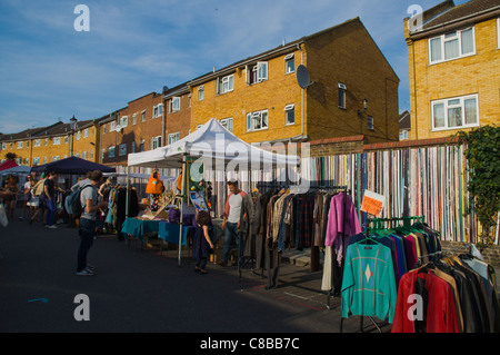 Second hand clothes stalls Portobello Road street Notting Hill district London England UK Europe Stock Photo