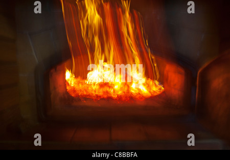 Wood coals glowing inside fireplace , Finland Stock Photo