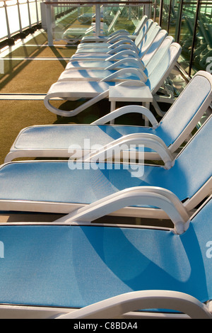 empty Sun loungers on board cruise ship Stock Photo