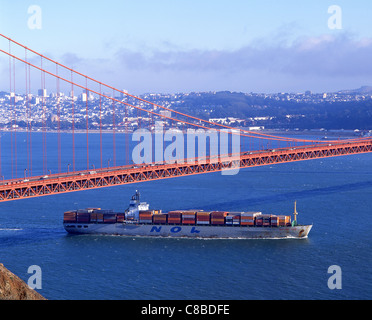 Container ship passing under Golden Gate Bridge, San Francisco Bay Area, San Francisco, California, United States of America Stock Photo