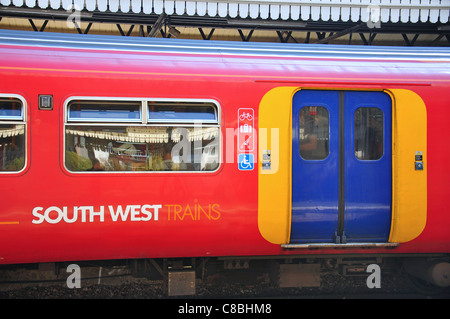 Train on platform at Clapham Junction Railway Station, Battersea, London Borough of Wandsworth, London, England, United Kingdom Stock Photo