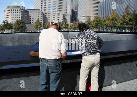 Visitors Making a Rubbing of a Name at the-  Newly Opened to the Public-  National September 11th Memorial in New York Stock Photo