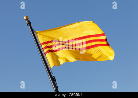 The flag of the former South Vietnam flying over a Vietnam War Memorial in St. Cloud, Minnesota, USA. Stock Photo