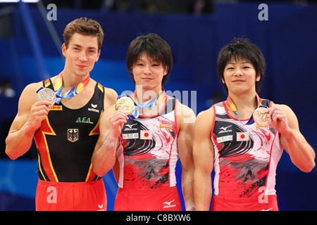 Philipp Boy (GER), Kohei Uchimura (JPN), Koji Yamamuro (JPN) pose at 2011 World Artistic Gymnastics Championships Award ceremony