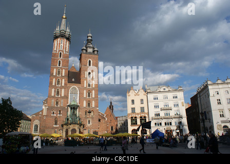 Mariacki Basillica, the most beautiful polish church and other old buildings on Main Square (Rynek Glowny) in Cracov, Poland. Stock Photo