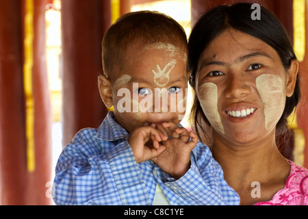 NYAUNG-U, MYANMAR-OCT 14: Unidentified mother and daughter wearing traditional Thanaka cream in Nyaung-U, Myanmar on October 14, Stock Photo