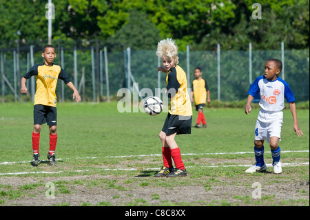 Football U11 boys making a header at Rygersdal Football Club Cape Town South Africa Stock Photo